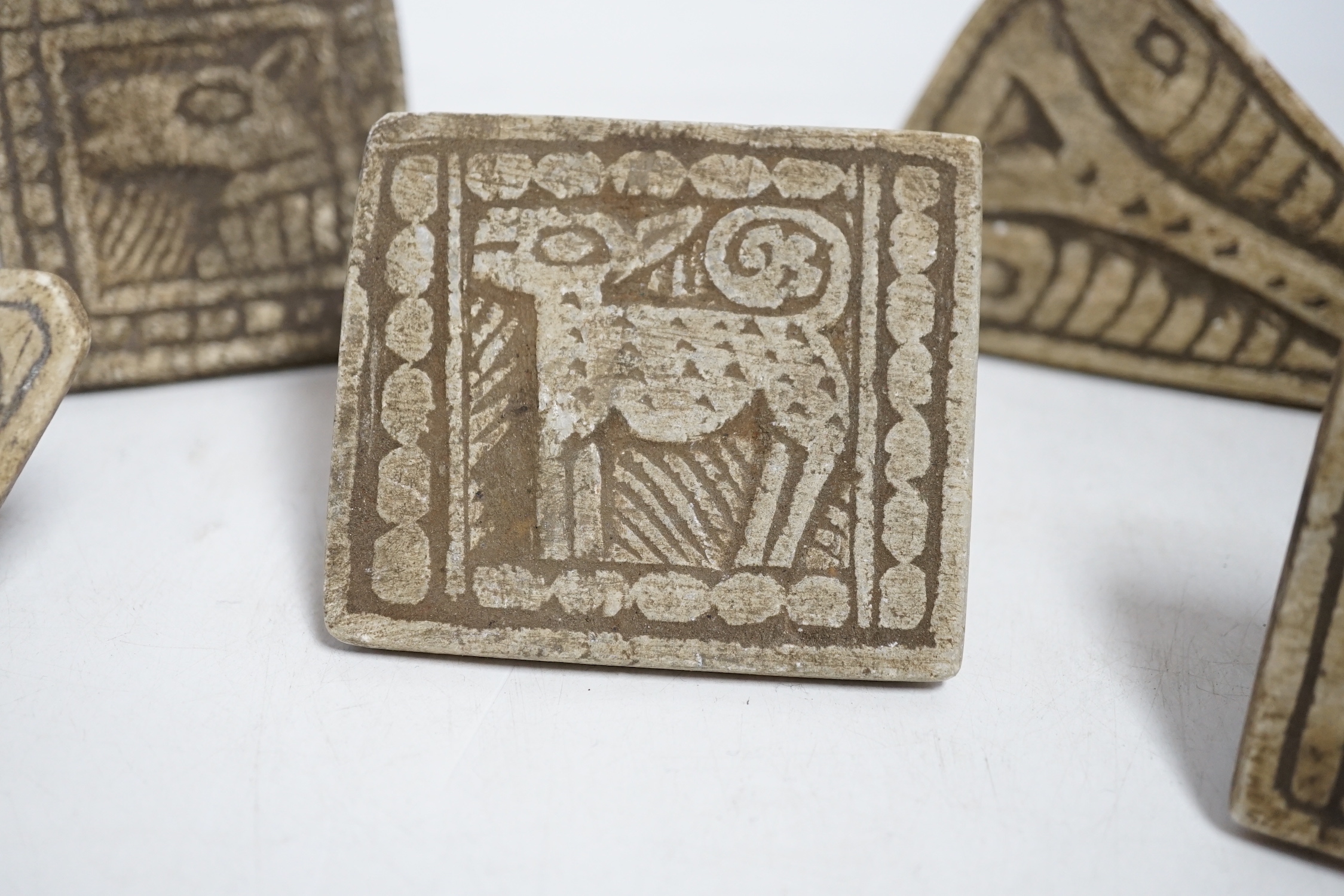 A group of five Middle eastern pottery moulds/stamps, largest, 10cm long